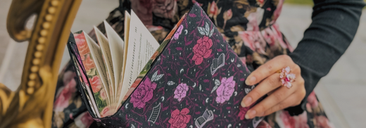 Pink and purple floral fabric dust jacket on a hardcover book