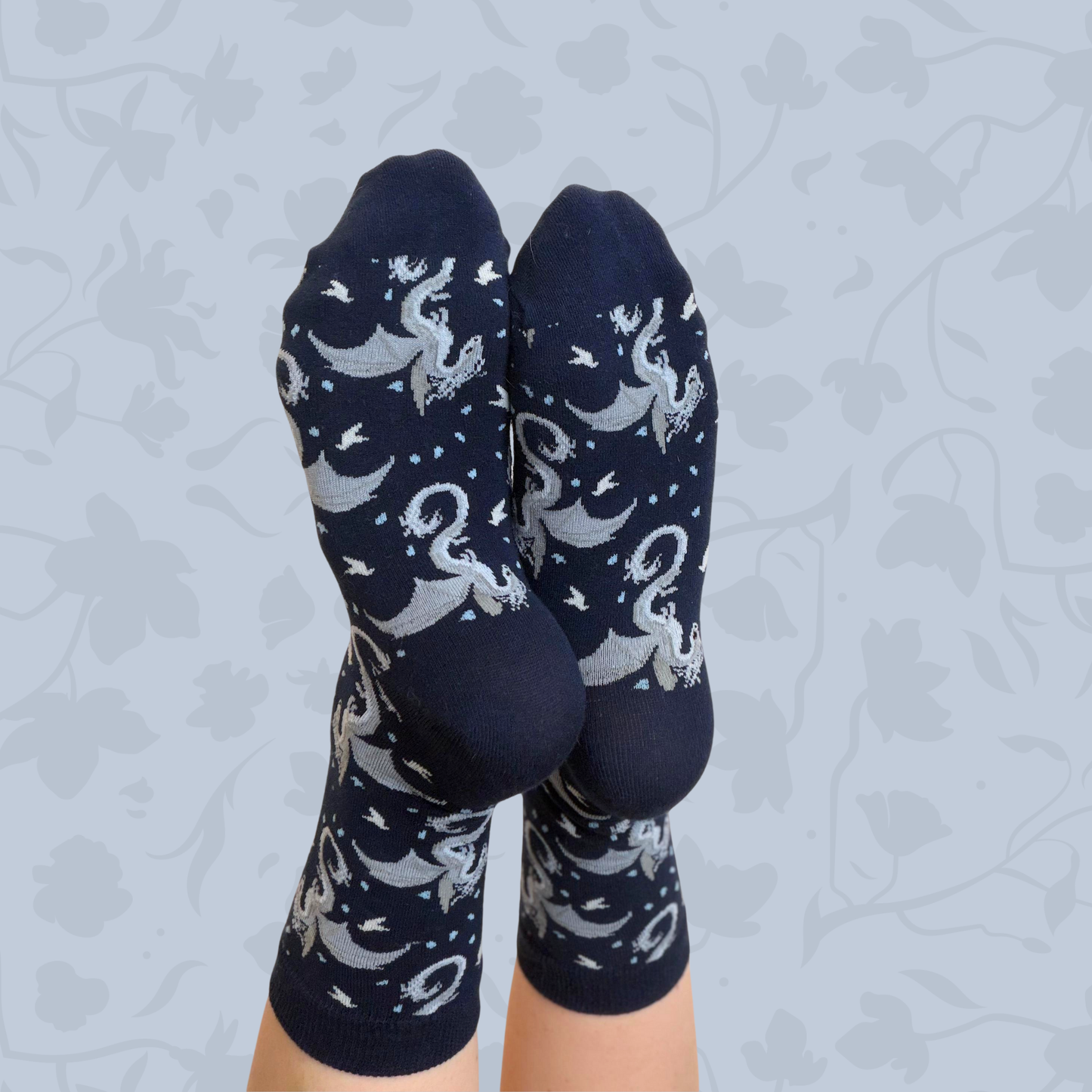 Socks featuring a Moonplume Dragon from the book When The Moon Hatched by Sarah A. Parker