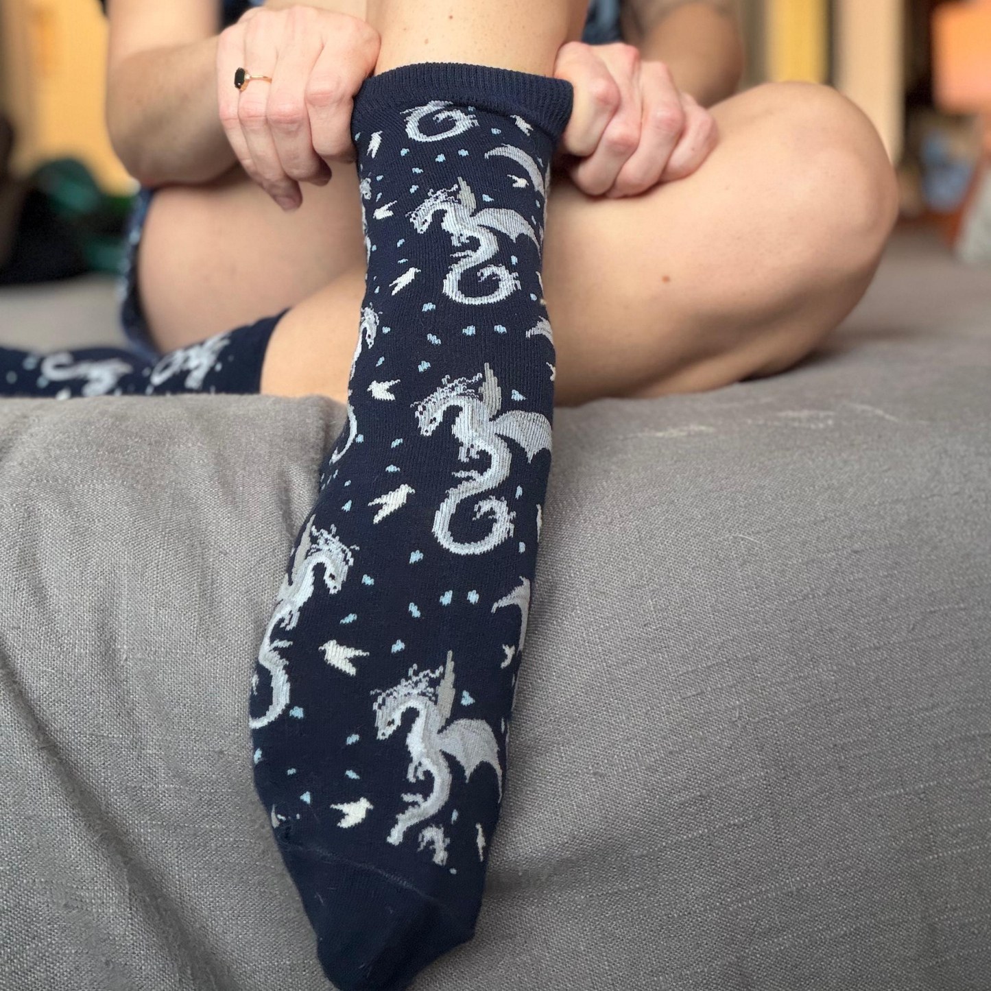 Socks featuring a Moonplume Dragon from the book When The Moon Hatched by Sarah A. Parker