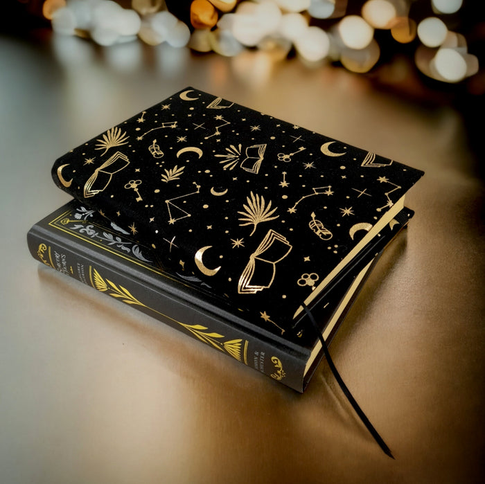 black and gold celestial reading fabric dust jacket book cover