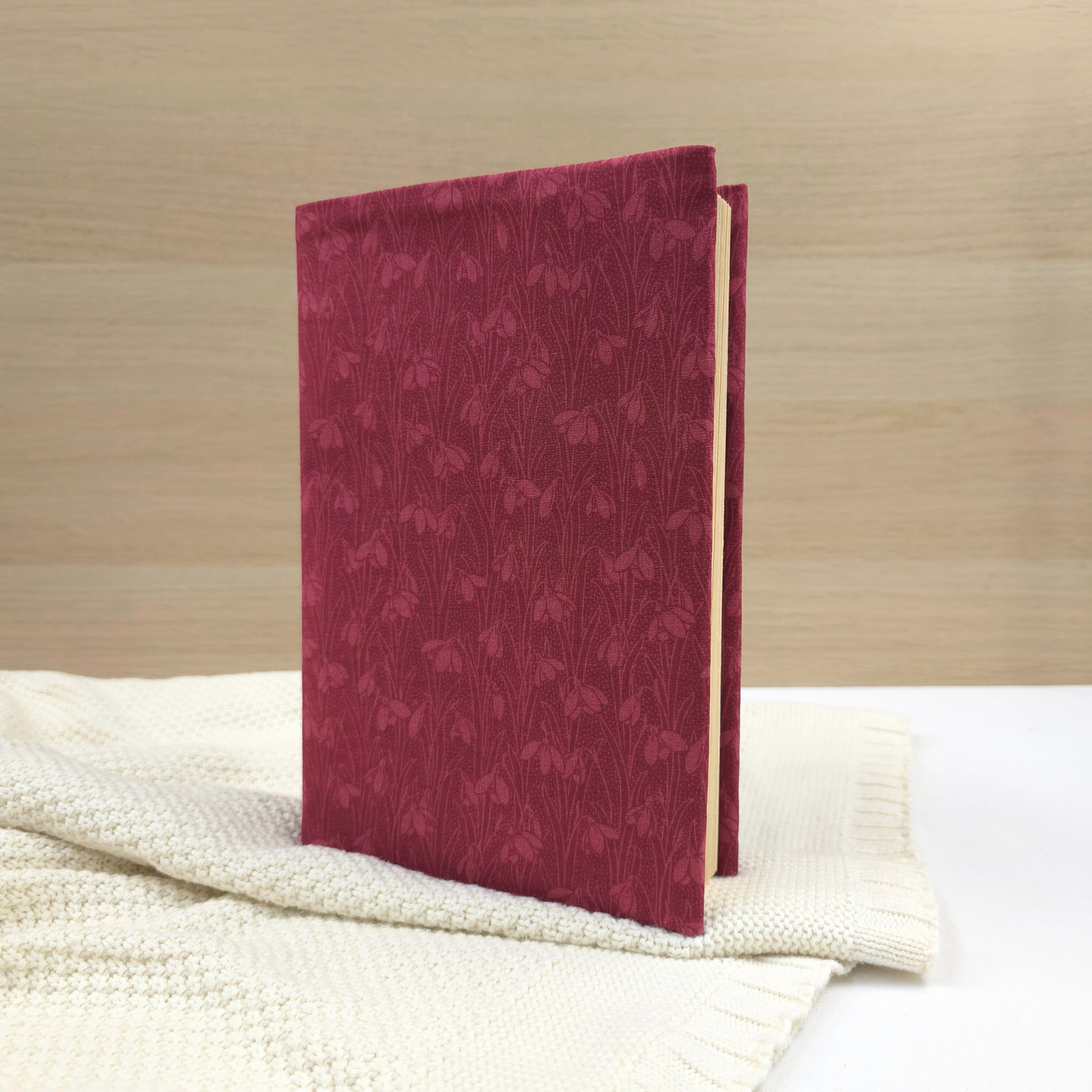 Snowdrops in Berry Red fabric dust jacket